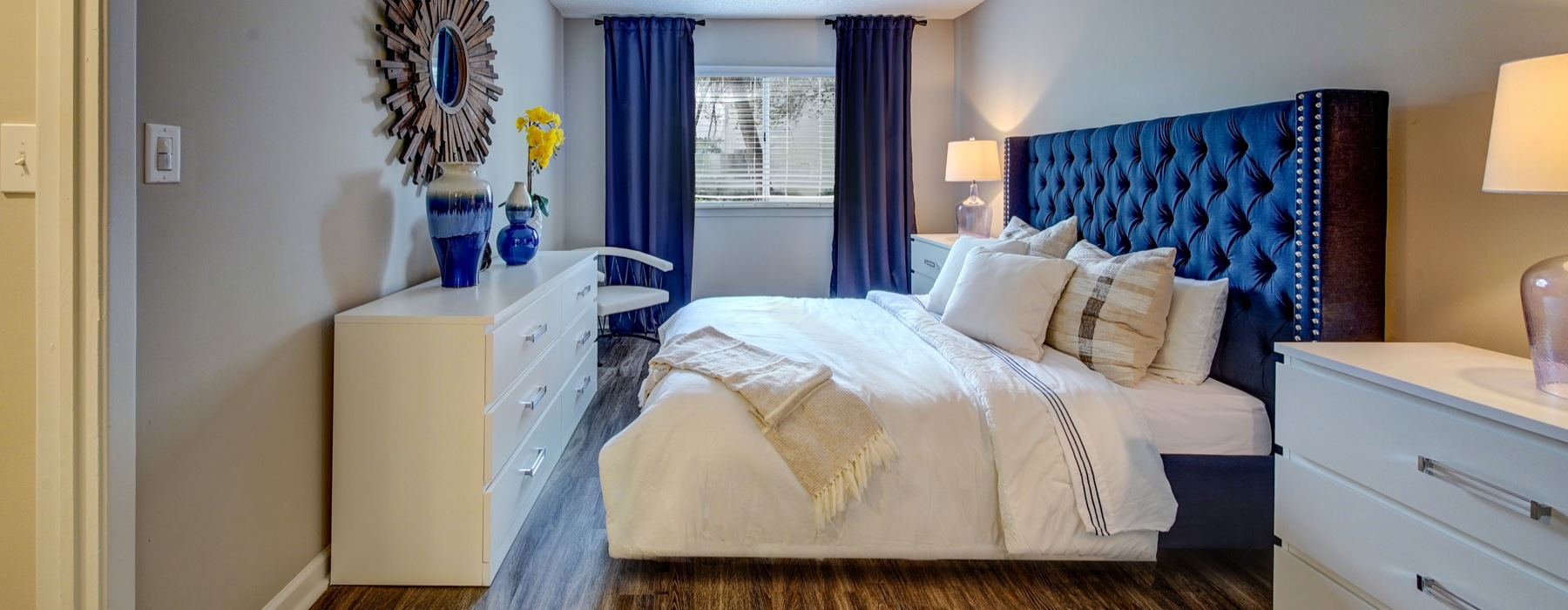 Typical Apartment Bedroom which fits a king size bed with end tables and a large dresser